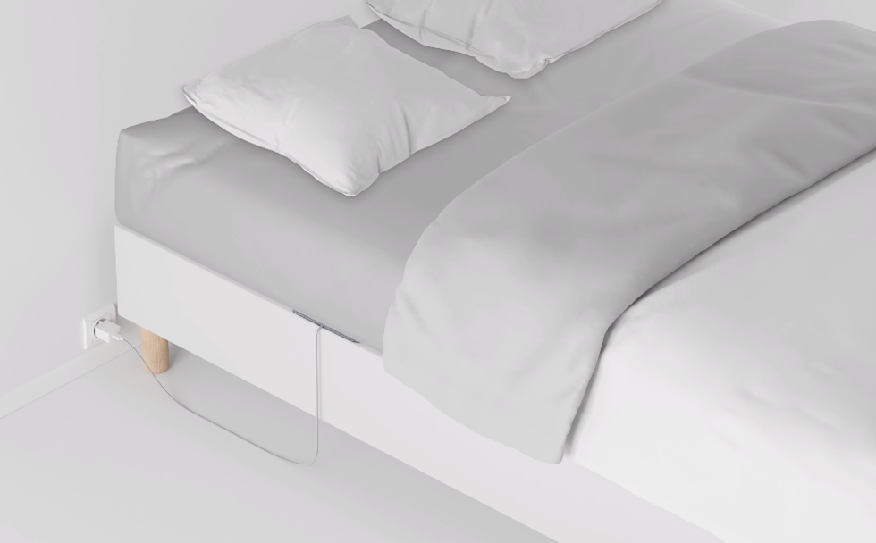 Image showing the Withings Sleep monitor beneath a mattress