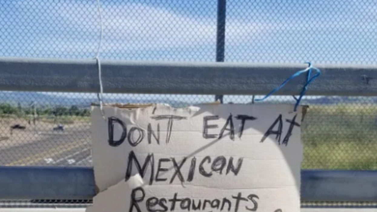 People Are Applauding The Good Samaritan Who Removed A Racist Sign From Busy Road