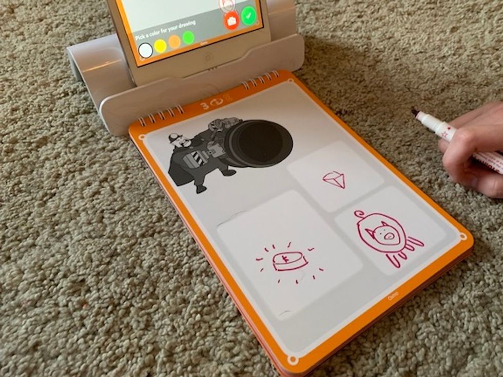 Drawings, like those of a pig or jewel here, made in the Story Studio storybook end up in the Osmo story app