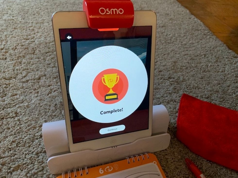 Osmo delivers a lot of positive feedback to children in the app, like the trophy pictured here, as they play with the Story Studio