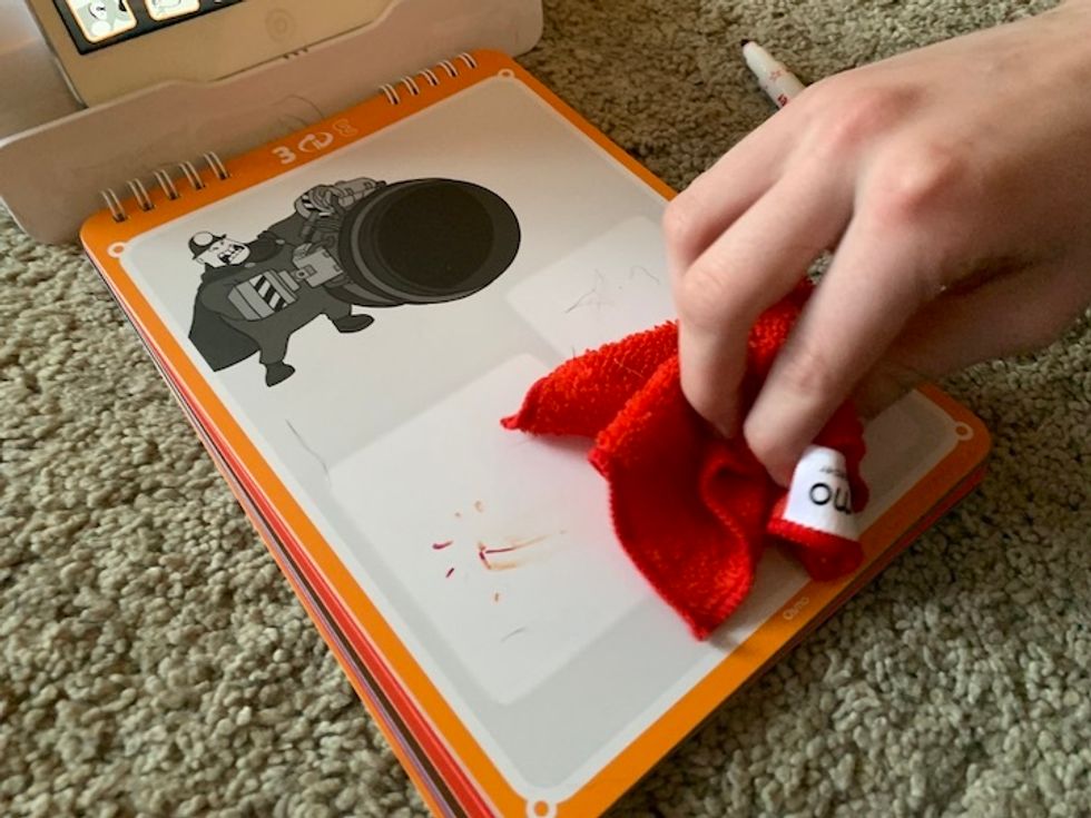 Pages in the Osmo Super Studio storybook, pictured here, are easily erased, meaning they can be used multiple times by multiple children