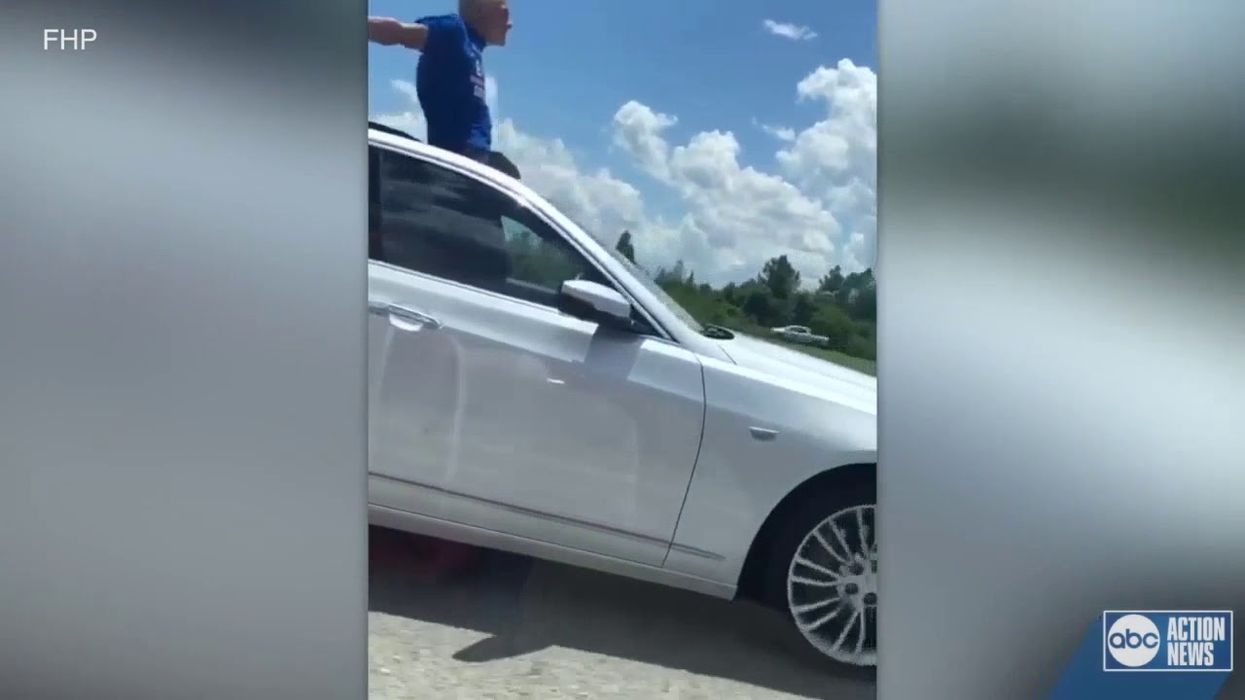 Florida man caught standing in sunroof while driving on interstate