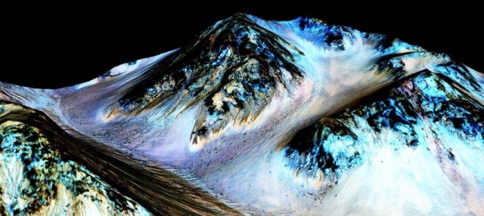 NASA just found out what these dark streaks on Mars are, and it's game-changing.