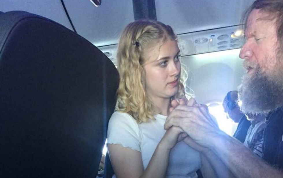 The story of her helping a man on a flight went viral. She hopes it inspires others.