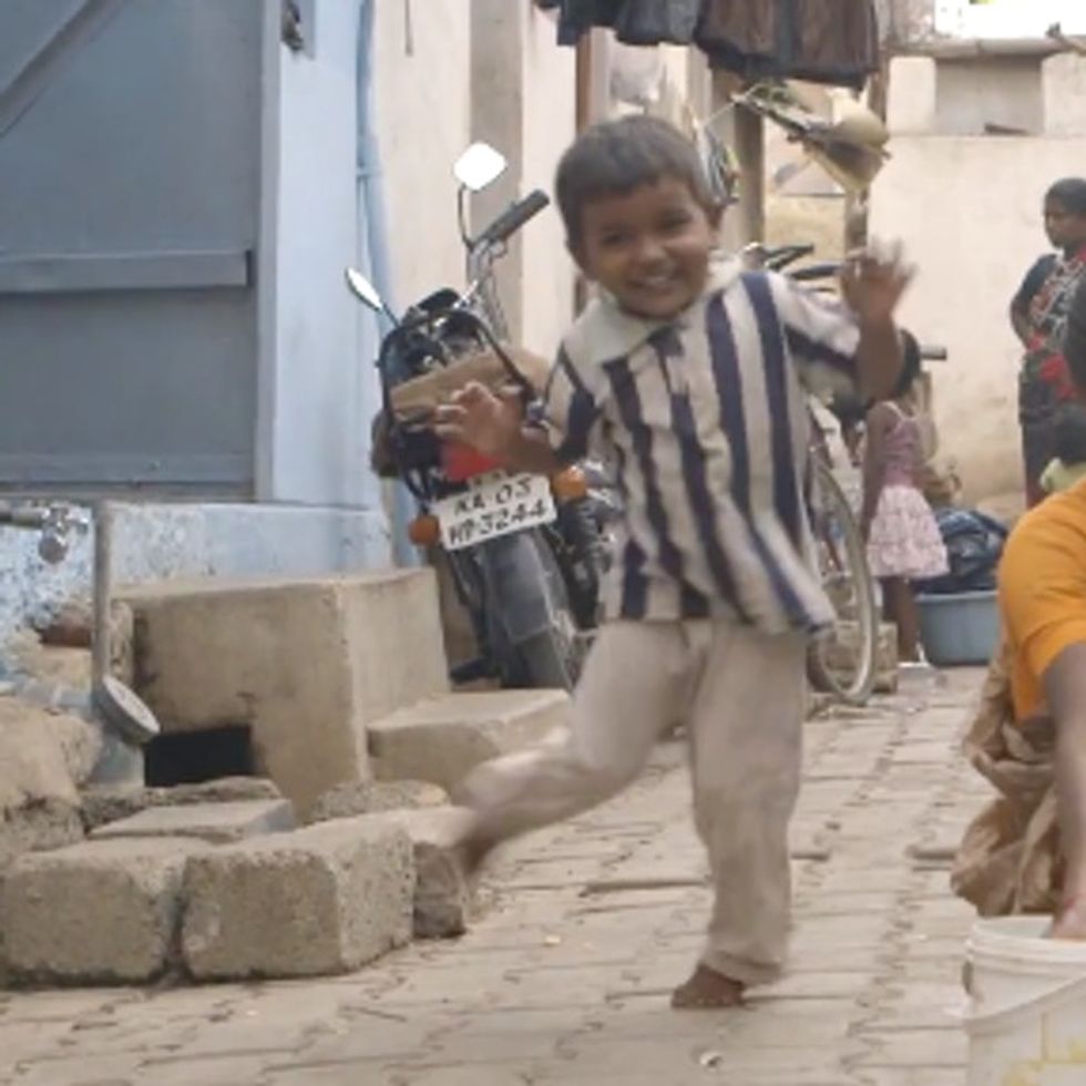 Can You Guess Why This Adorable Little Boy Is Dancing In The Street?