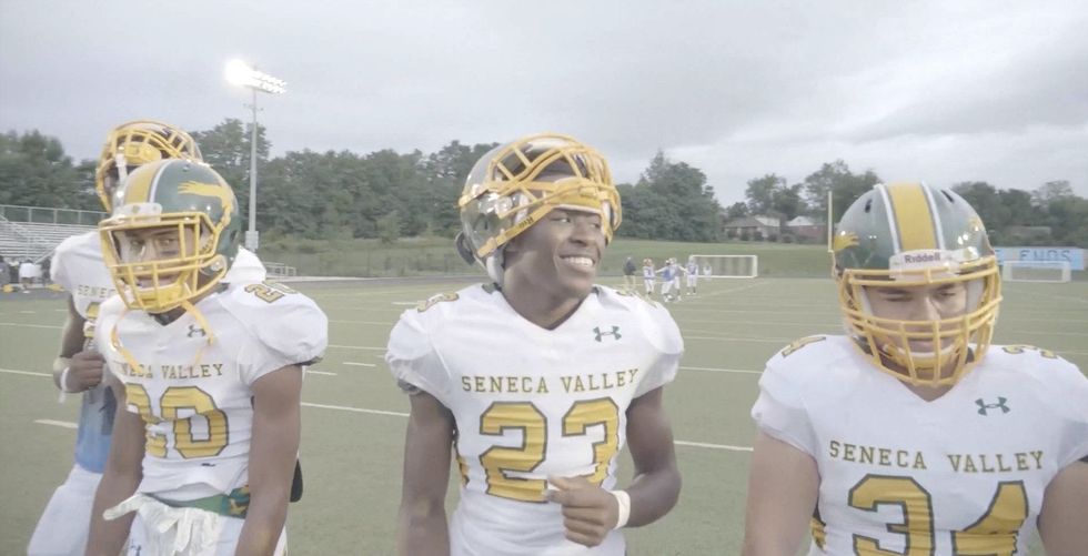 Players on this football team often face hard times. Here's how their coaches are helping.