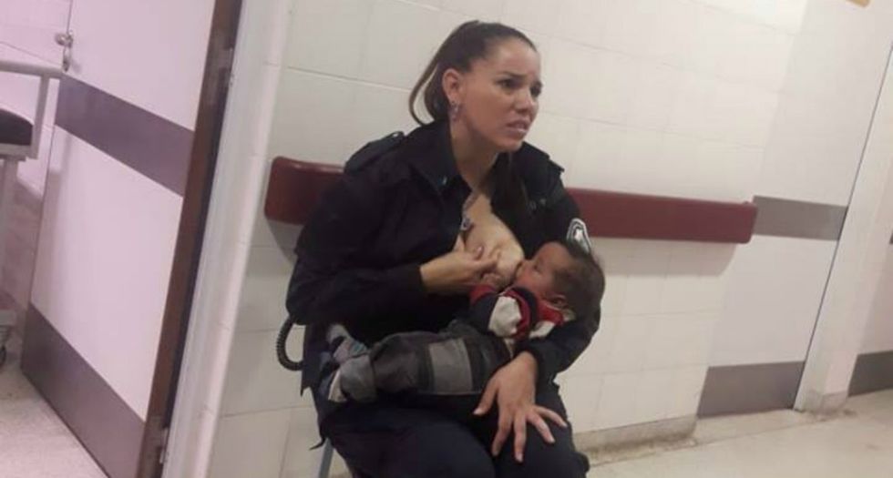 Photo of police officer breastfeeding a stranger's hungry infant is warming hearts around the world.