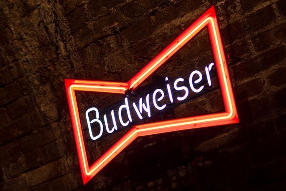 Budweiser tries to apologize for old sexist ads by re-doing some of them for today’s woman.