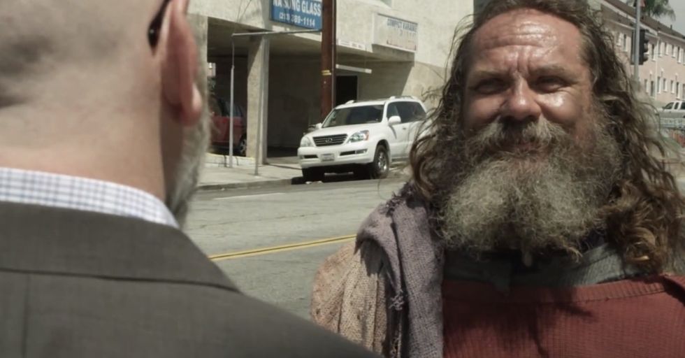 By Day, He Wears A Suit. By Afternoon, He's In Rags … By Choice.