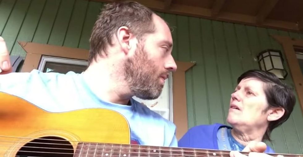 He sings to his mom on her porch, although she doesn't recognize home anymore.