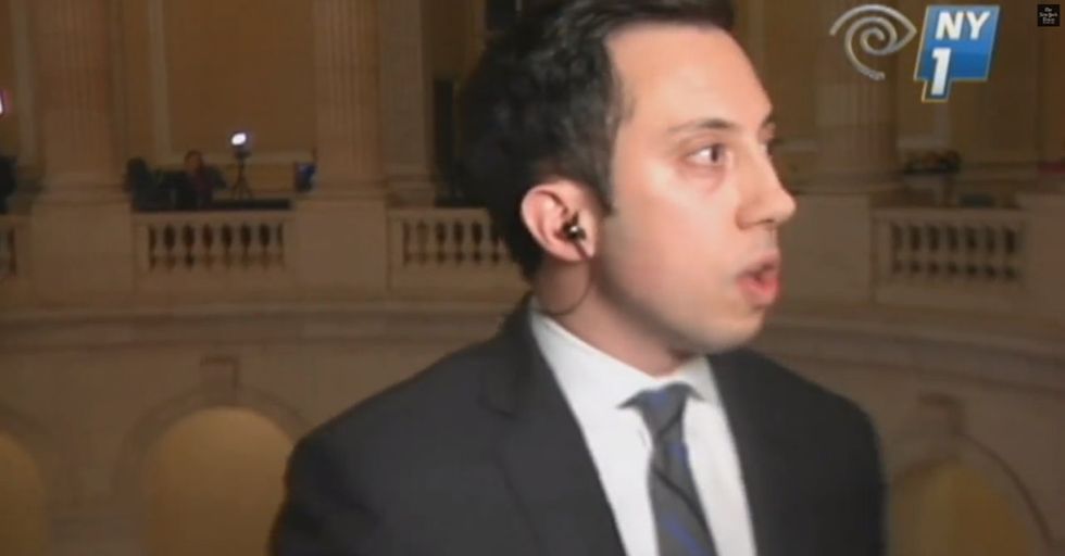 Reporter asks the wrong question. Politician threatens to throw reporter off a balcony. Yes, really.