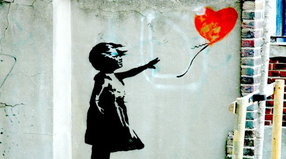 Banksy Has Updated His Famous 'The Girl With The Balloon' Artwork To Stand With Syria