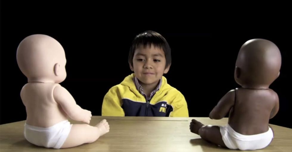 Here's What Happens When You Put A Few Little Kids In A Room With 2 Dolls In 2 Different Colors