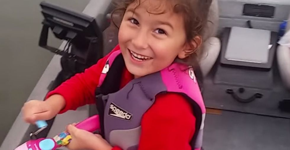An adorable video of little girl reeling in a fish can teach us all a lesson.