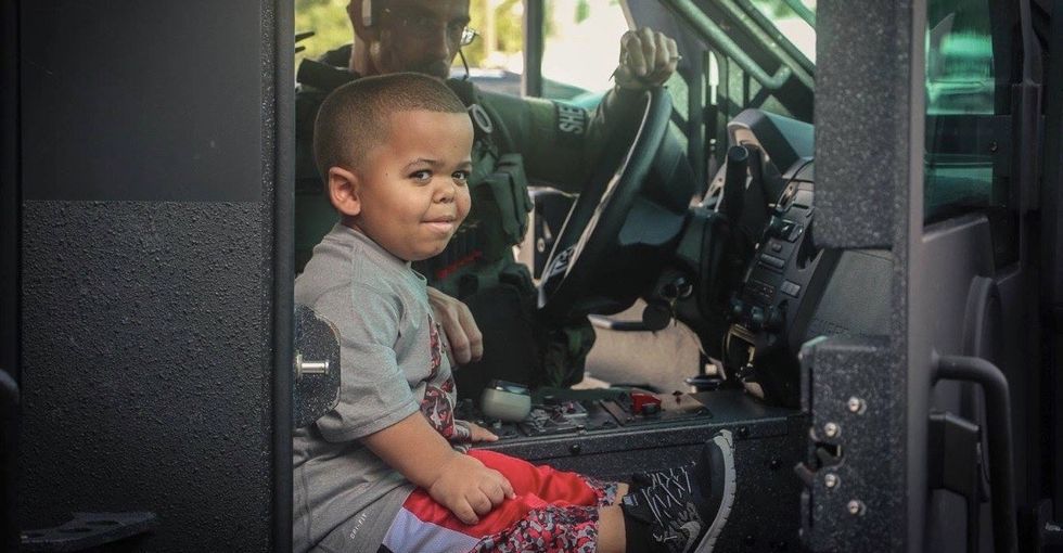 Terminally ill 7-year-old gets his Halloween wish granted and fights off the walking dead.