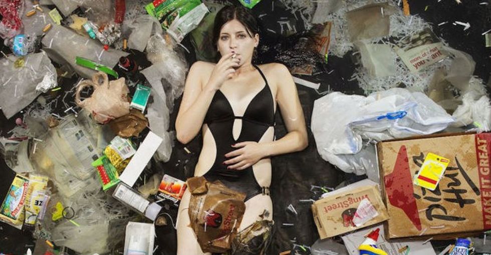 An Artist Shows What 7 Days Of Consumption Looks Like By Having People Lie In Their Own Garbage