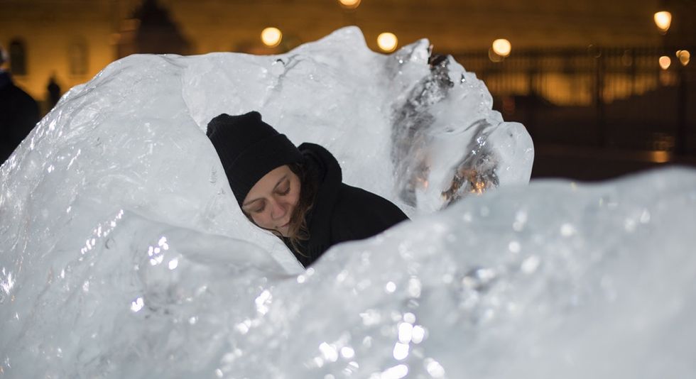 Parisians hug, touch, and cuddle with these giant blocks of ice — just like the artist wanted.