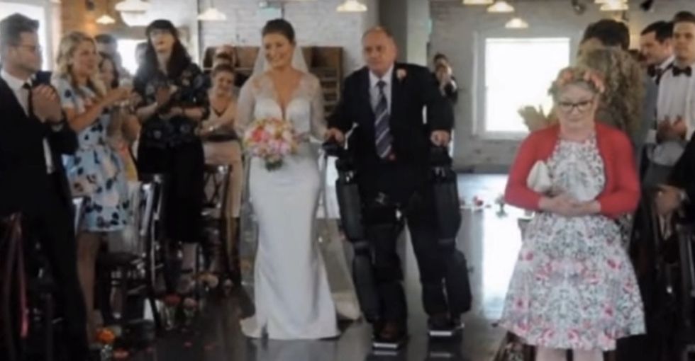A paralyzed dad lived his dream by walking his daughter down the aisle.