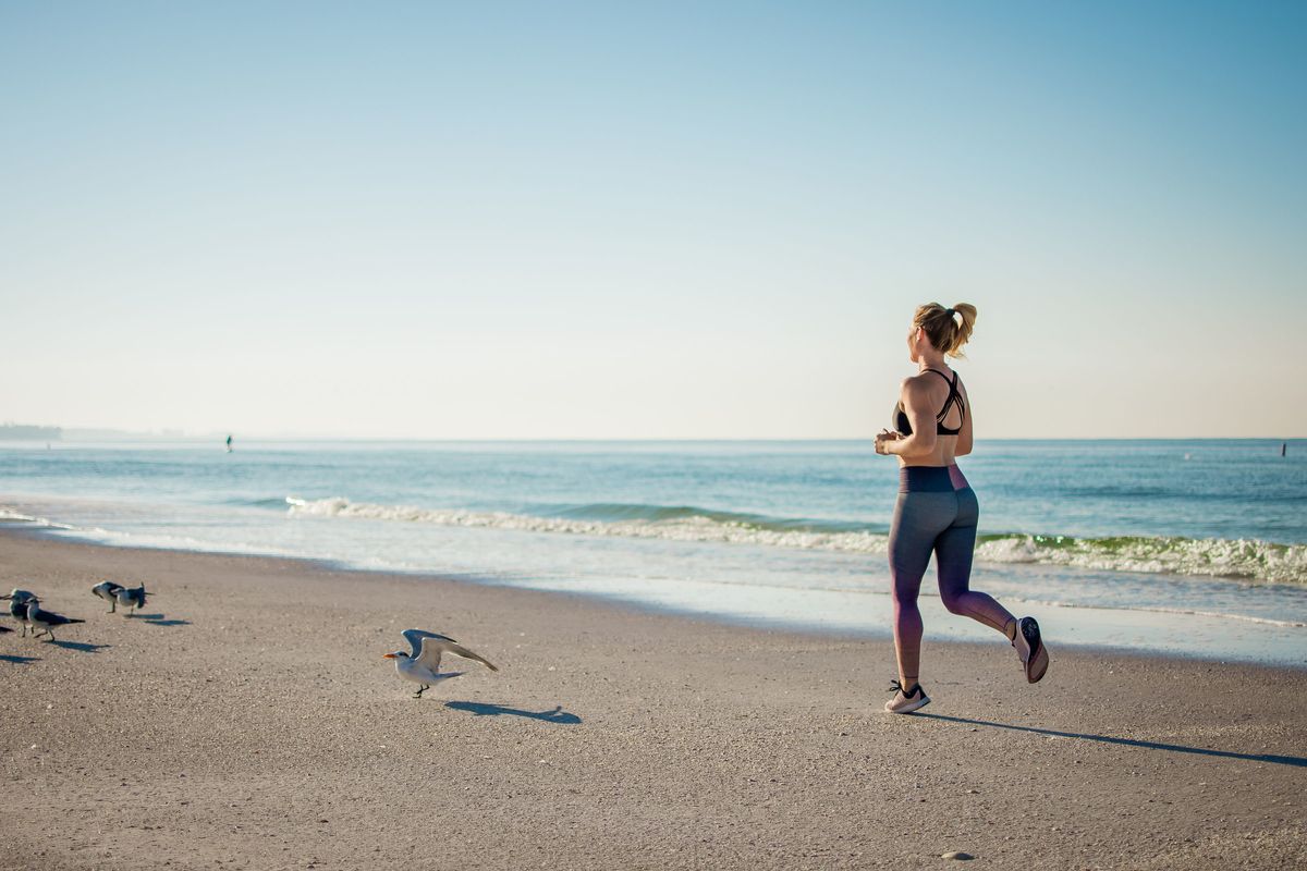 woman jogging on the beach