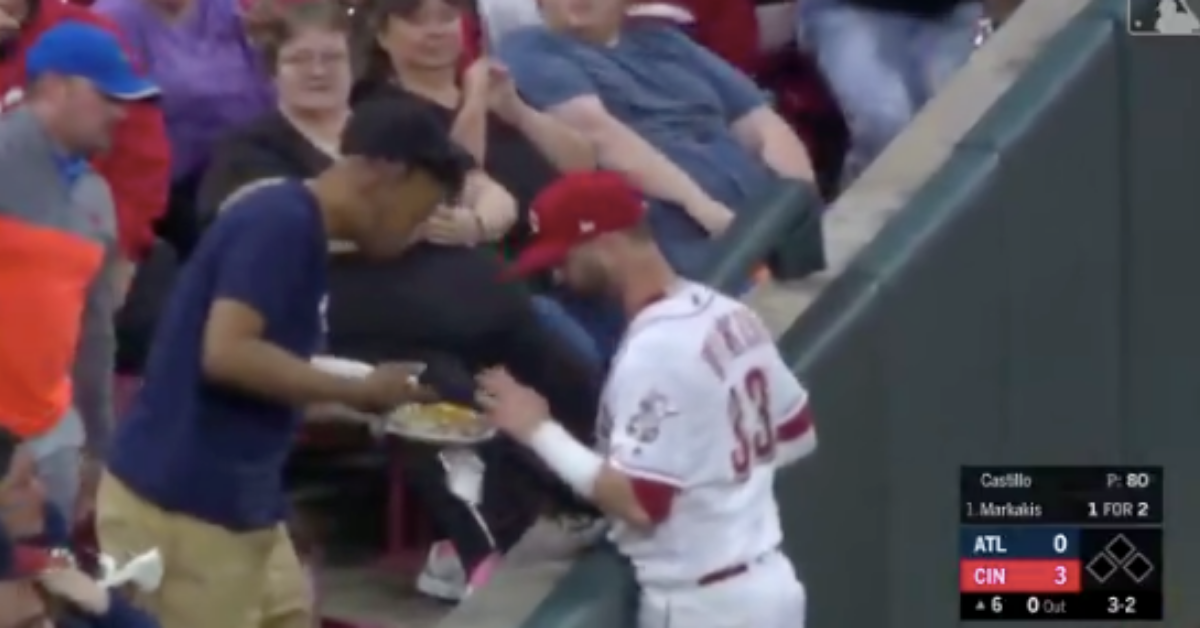 Baseball Player Distracted By Fan's Nachos After Catching Ball Mid-Game