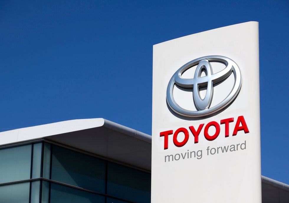 a photo of a Toyota sign at a dealership