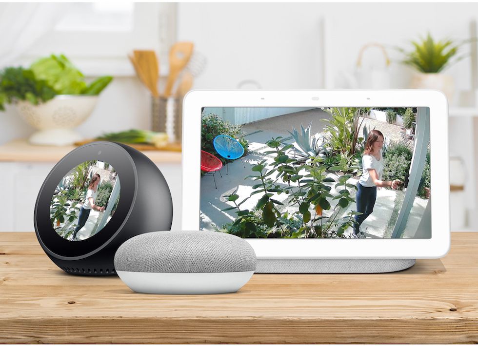 The new Wi-Fi Floodlight Security System integrates with devices, pictured here, from Amazon and Google