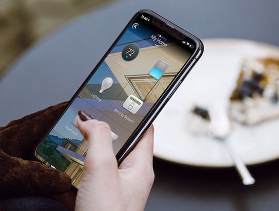 The new operating system is optimized for each device, including mobile phones, pictured here, touchscreens and TVs