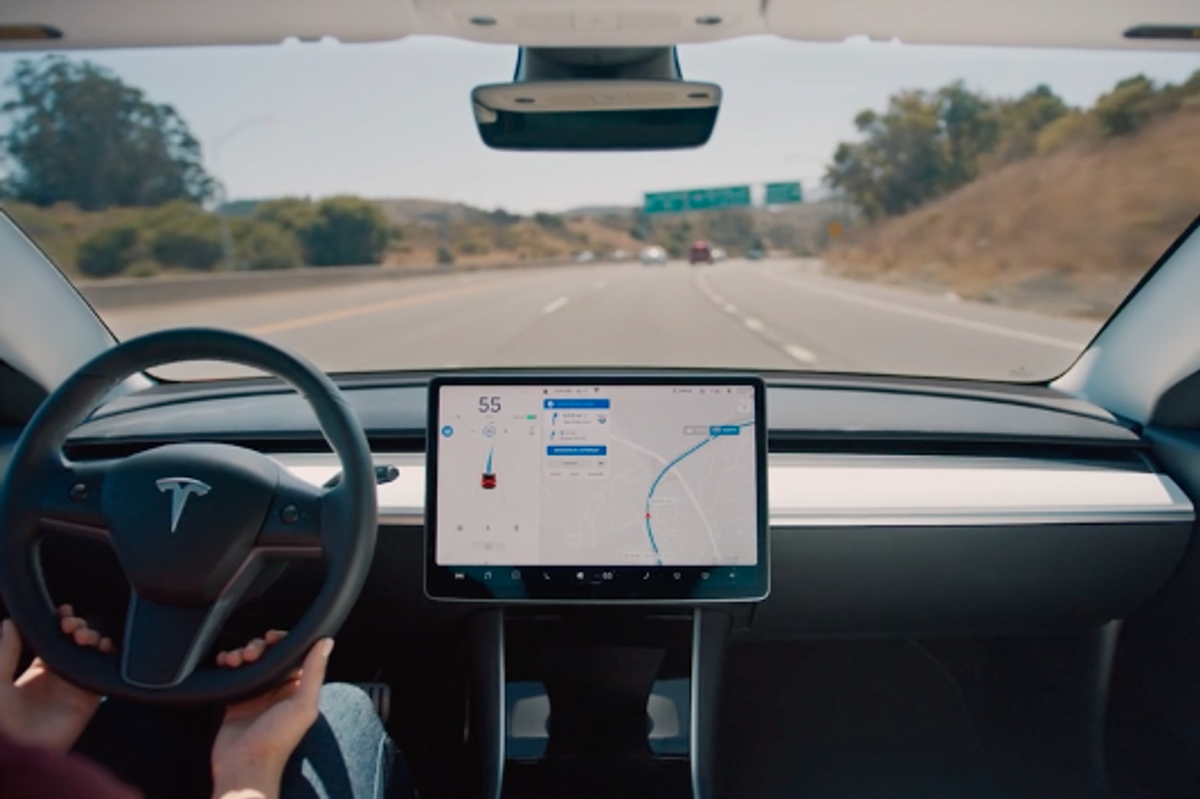 Photo showing a Tesla Model 3 driving with Autopilot enabled