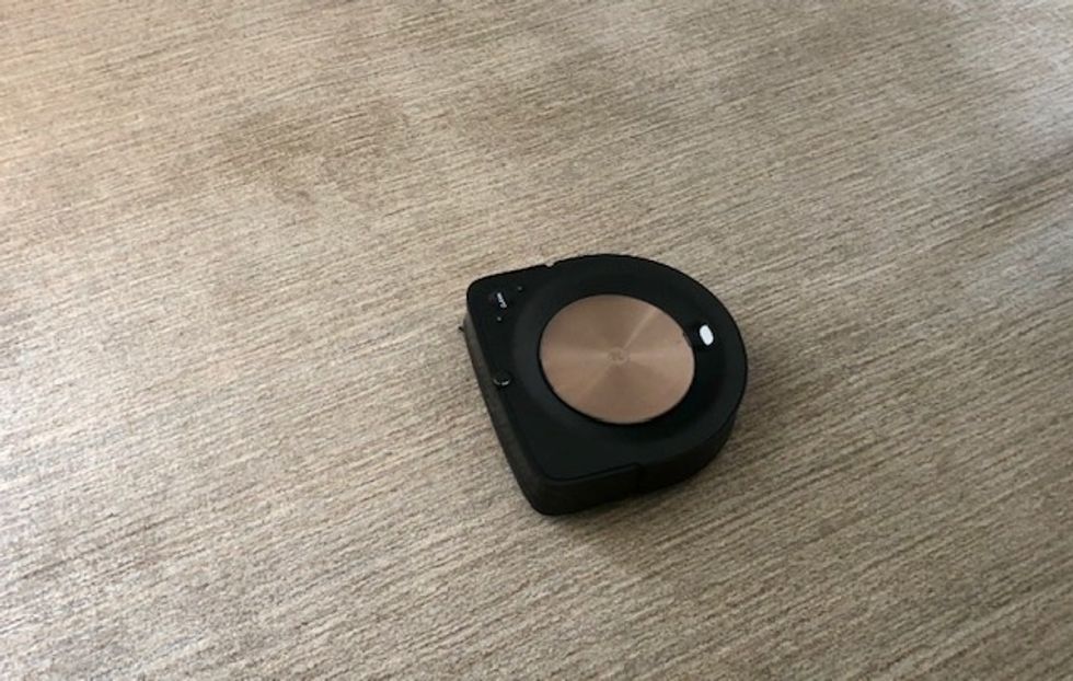 A new design puts the bin in the center of the Roomba s9+, which can lifted from the top