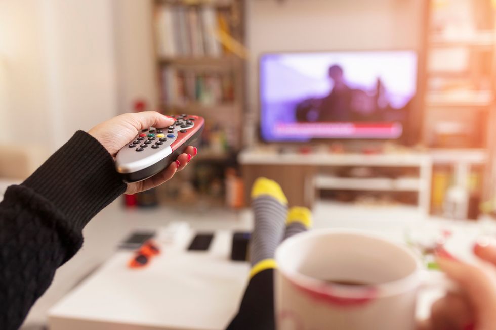 Coffee in hand, as this woman does here, kick back and start a movie marathon on a smart TV