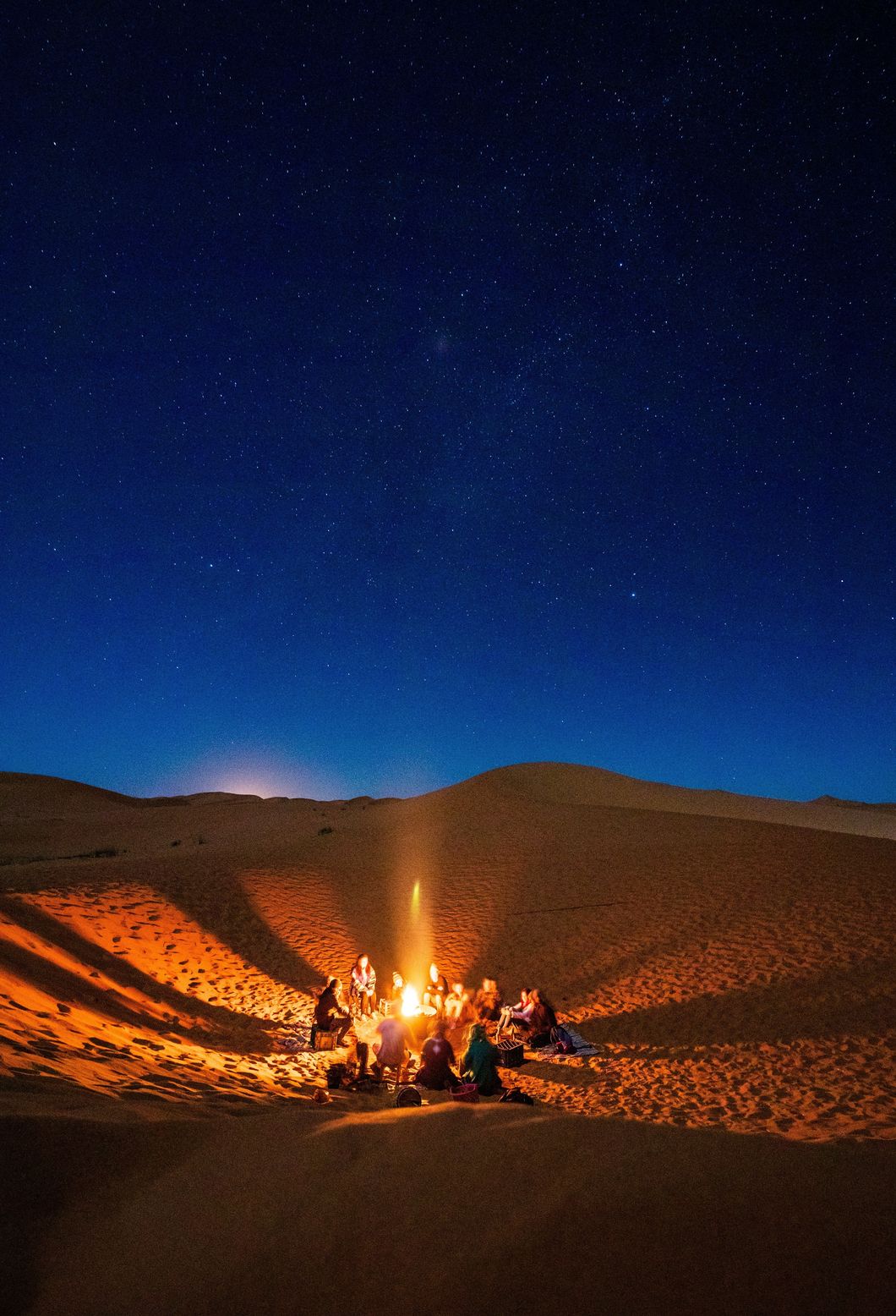 https://www.pexels.com/photo/people-sitting-in-front-of-bonfire-in-desert-during-nighttime-1703314/