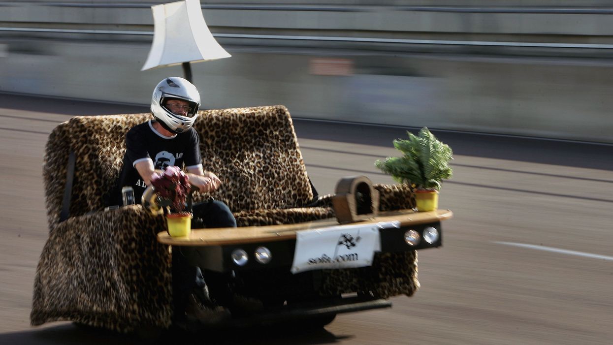 Watch couple ride sofa car down highway