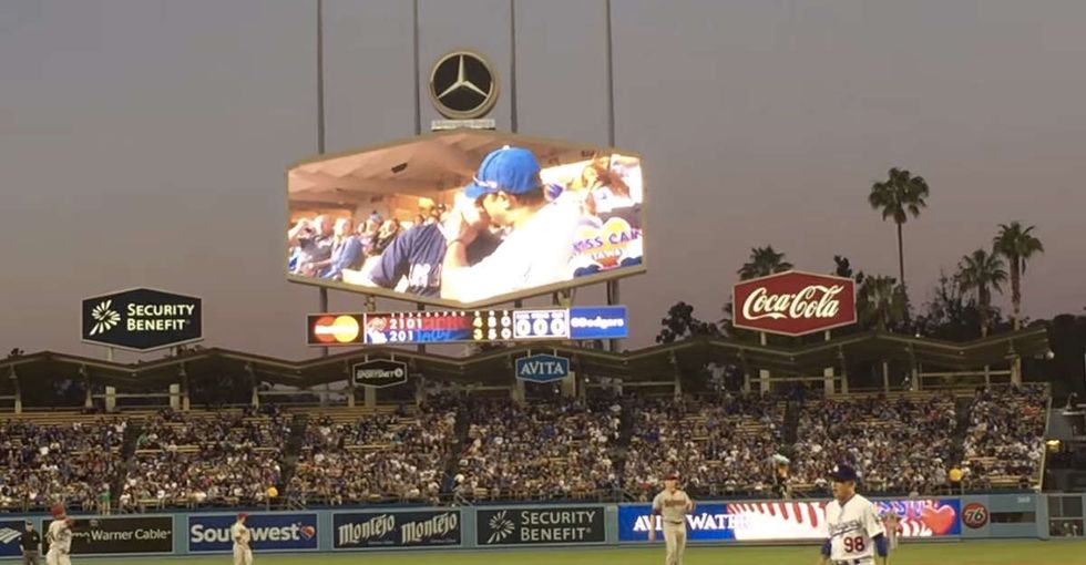 A baseball team showed a gay couple on the 'kiss cam.' Here's how the crowd reacted.
