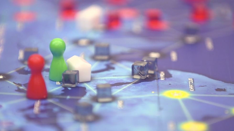 A popular board game gets rid of competition and gives players a more meaningful goal: teamwork.