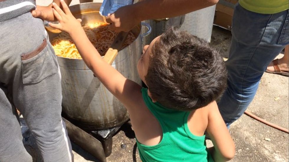 This kid came up to ask how much the food cost. I told him it was free.