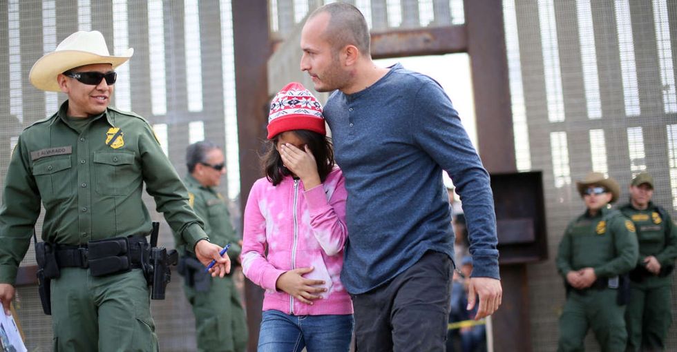 11 heartrending photos of families embracing across the U.S.-Mexico border.