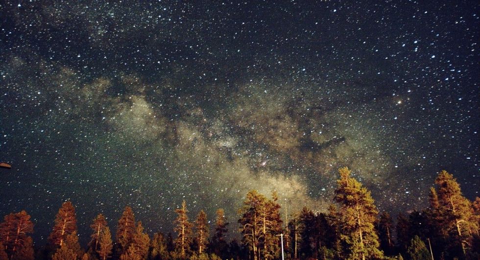 Hidden behind our own galaxy are clues to a mystery of epic proportions.