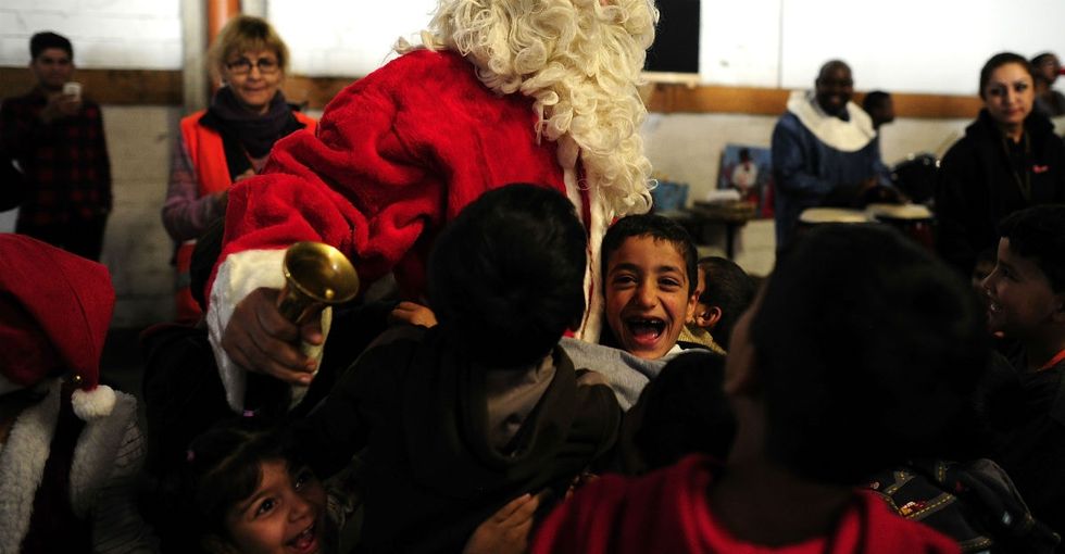 12 touching photos from Santa's visit to a refugee shelter in Germany.