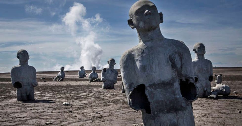 The Haunting Reason These Sculptures Were Designed To Sink Slowly Into The Mud Upworthy