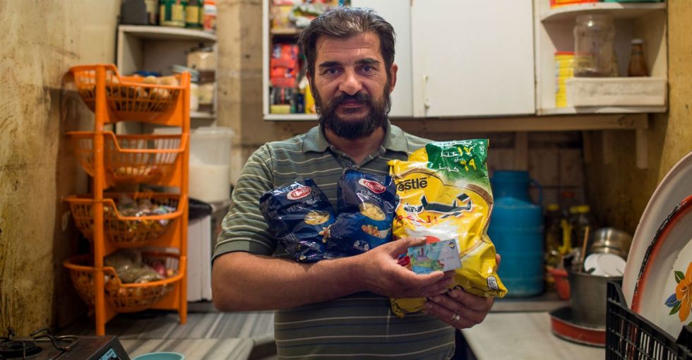 How some Syrian refugees can pay for food with the blink of an eye.