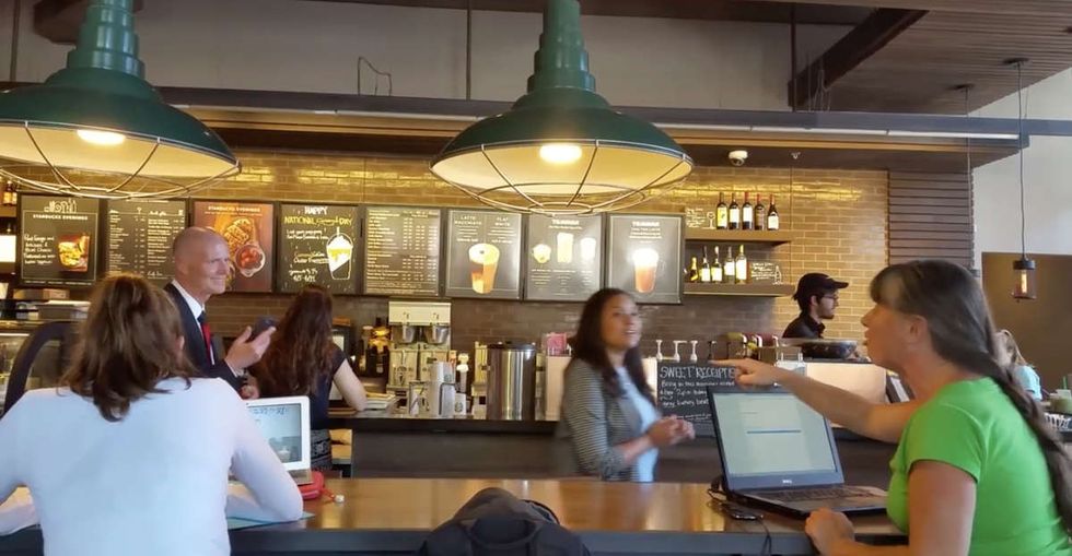 A woman yelled at Rick Scott at Starbucks. But did you actually hear what she said?
