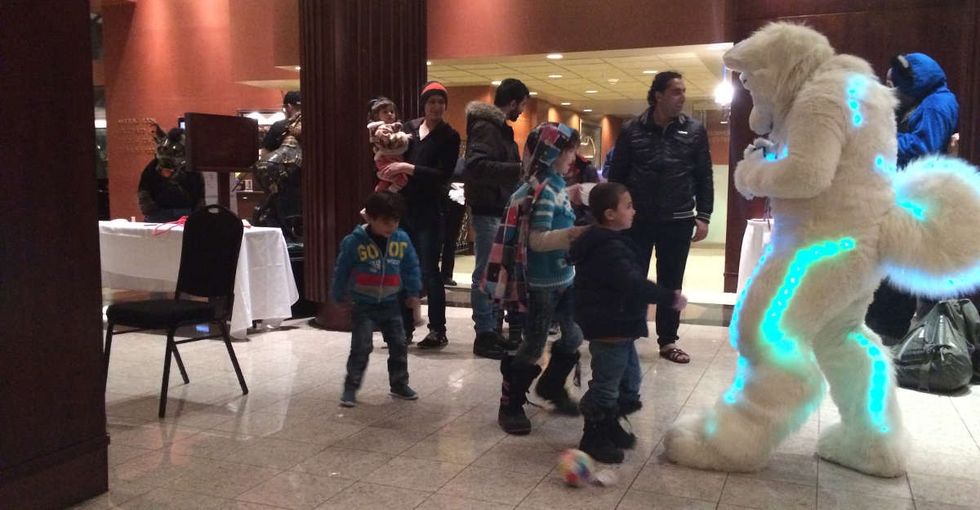 A group of Syrian refugees wandered into a furry convention — and magic happened.