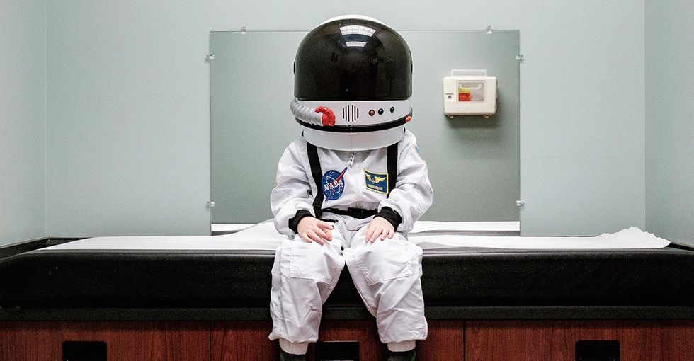 A dad took these touching photos of his 'astronaut' son exploring planet Earth.