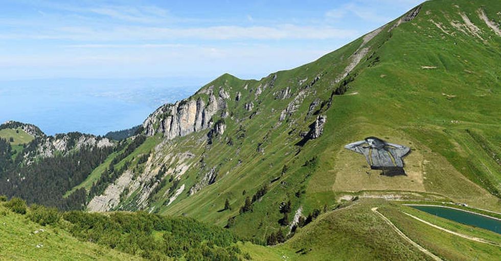 An artist painted a giant man on a hillside. In 3 weeks, it will be gone.