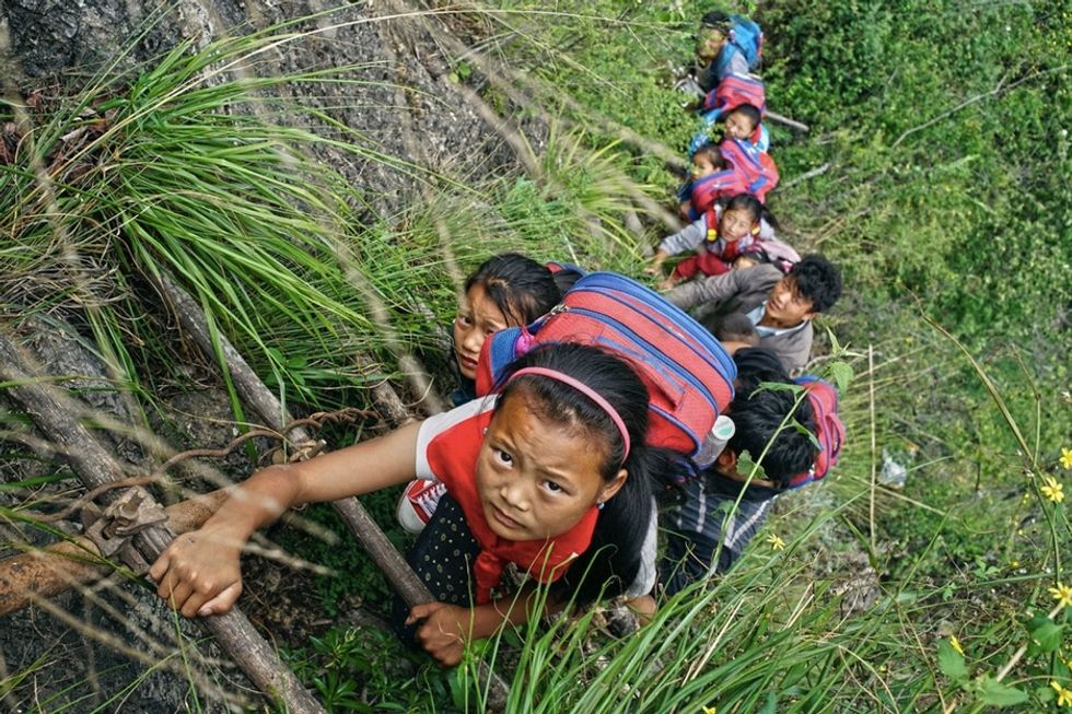 There's no bus, so these kids climb down a 2,600-foot ladder to school.