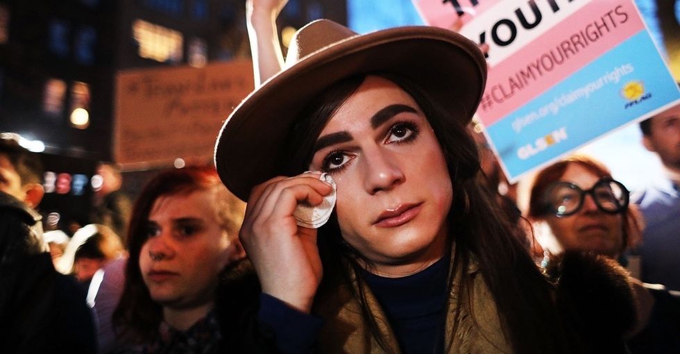 21 powerful photos from protests following Trump's anti-trans order.