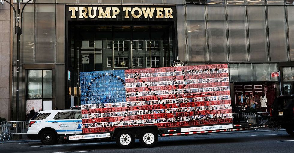 An artist made a two-sided painting, strapped it to a truck, and drove it to Trump Tower.
