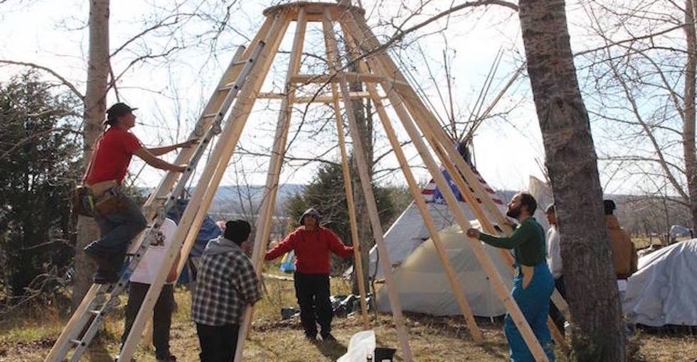 As temperatures drop, pipeline protesters join together to winterize Standing Rock.