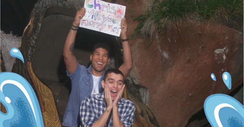 Despite his mom's wishes, he proposed to his boyfriend. With a sign. On Splash Mountain.