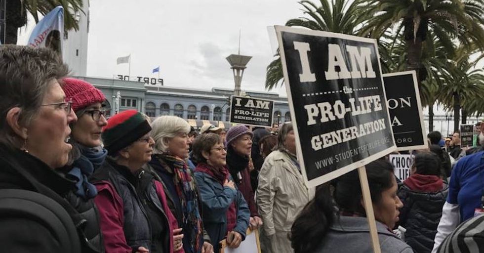 A pro-life and a pro-choice protest collided. There was singing and hugs.